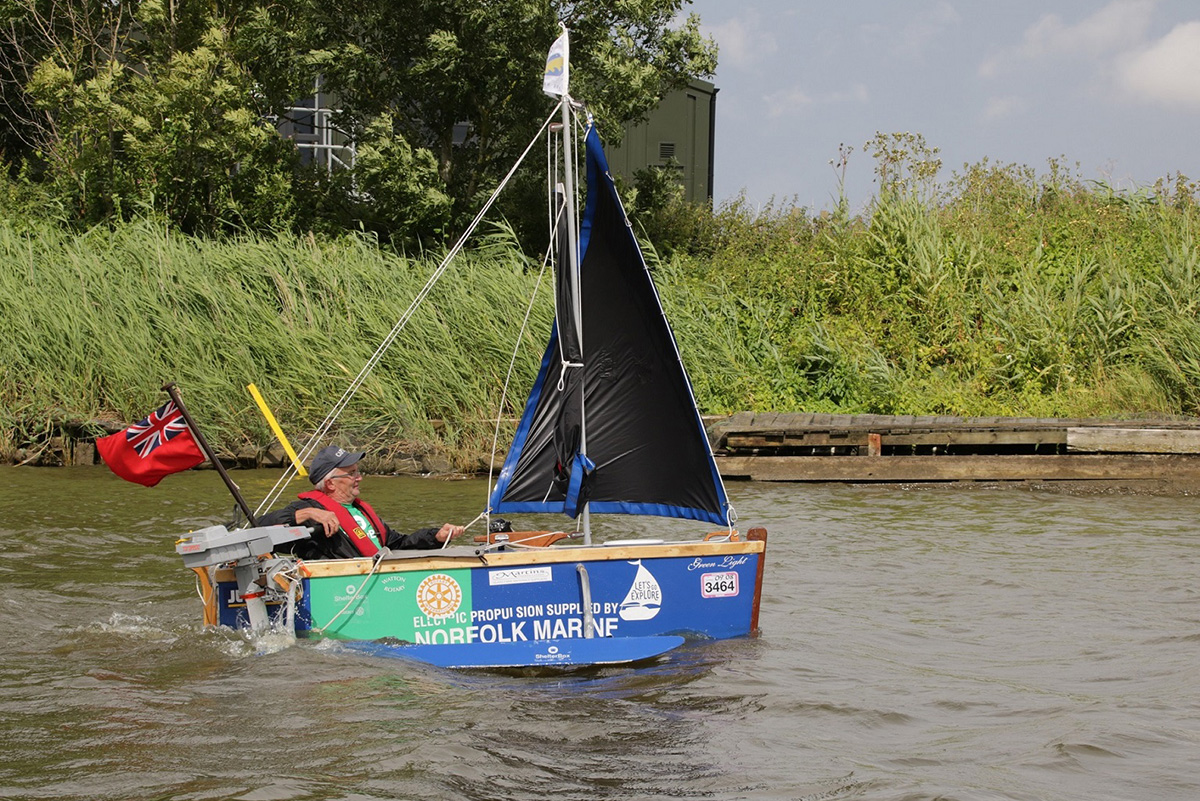 Man sailing on River Avon in a homemade boat