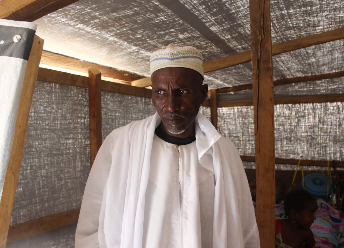 Man inside a durable shelter in Cameroon