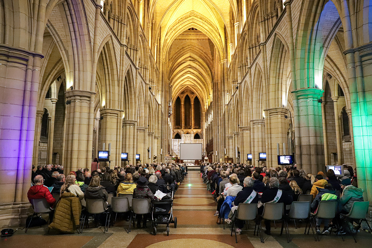 People sitting in Truro cathedral at the ShelterBox Christmas Carol Concert