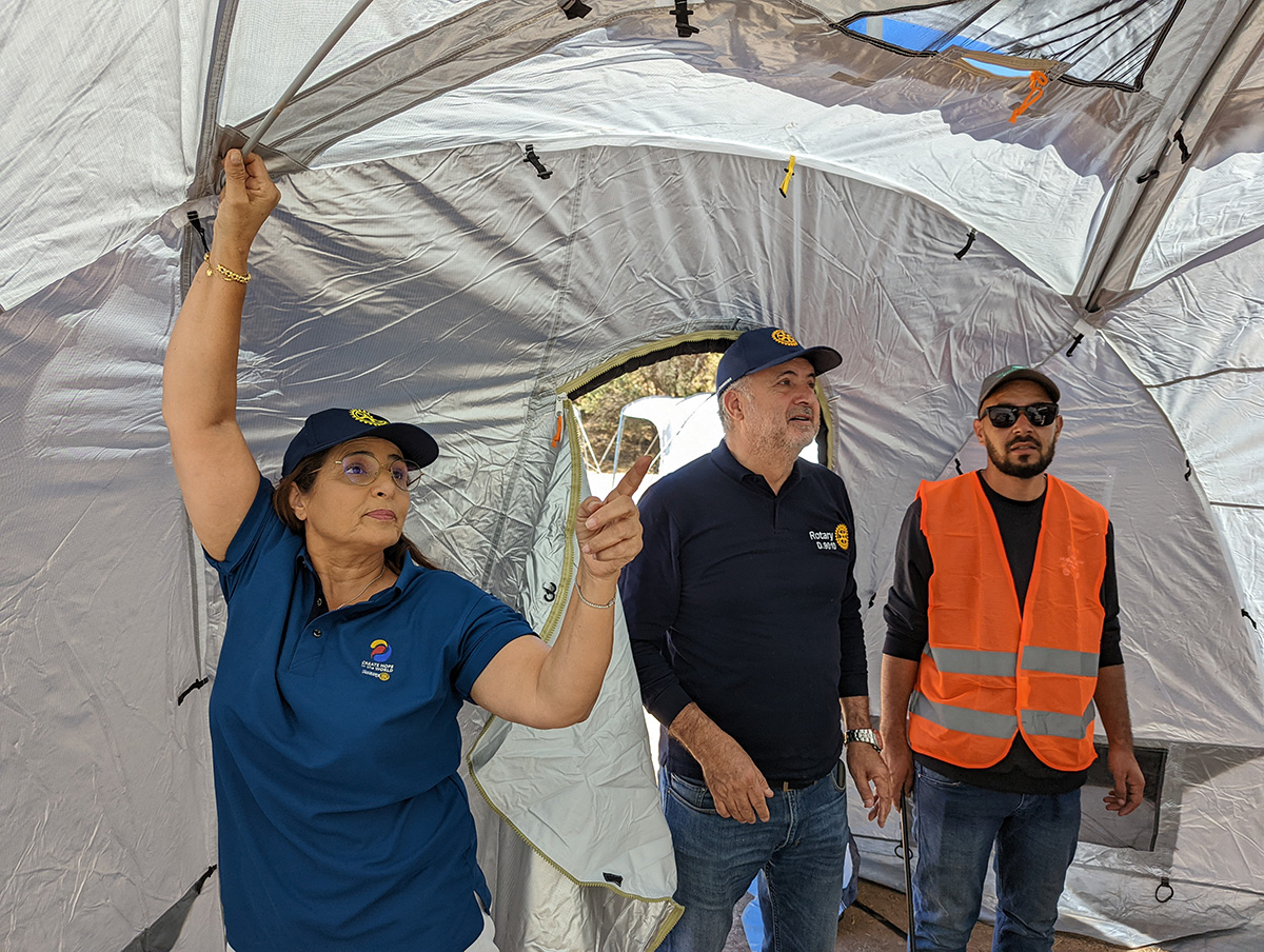 Three people inside a ShelterBox tent in Morocco