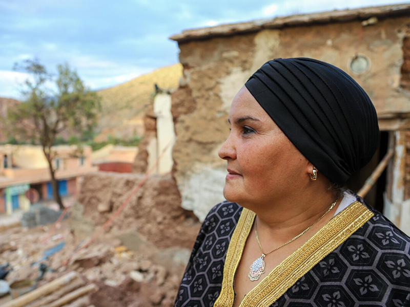 Woman standing in the remains of her house destroyed in the Morocco 2023 earthquake