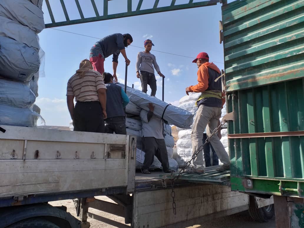 Partners Bahar unload aid for north east Syria in October 2019