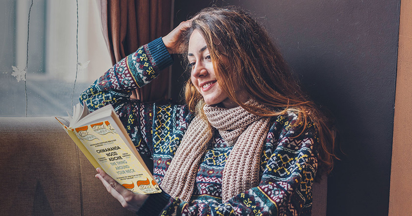 Woman reading a book for ShelterBox book club