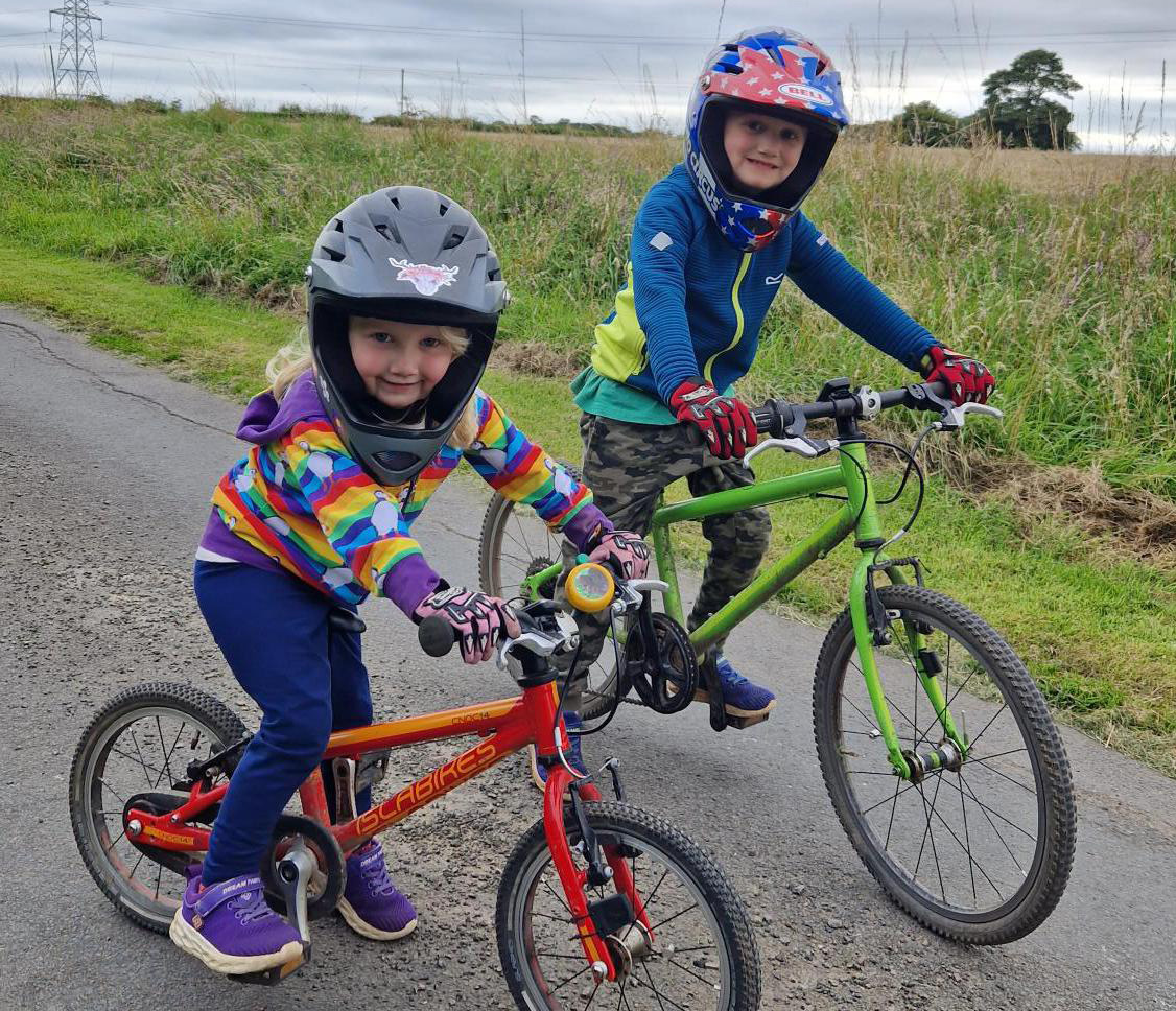 Two young children on bikes