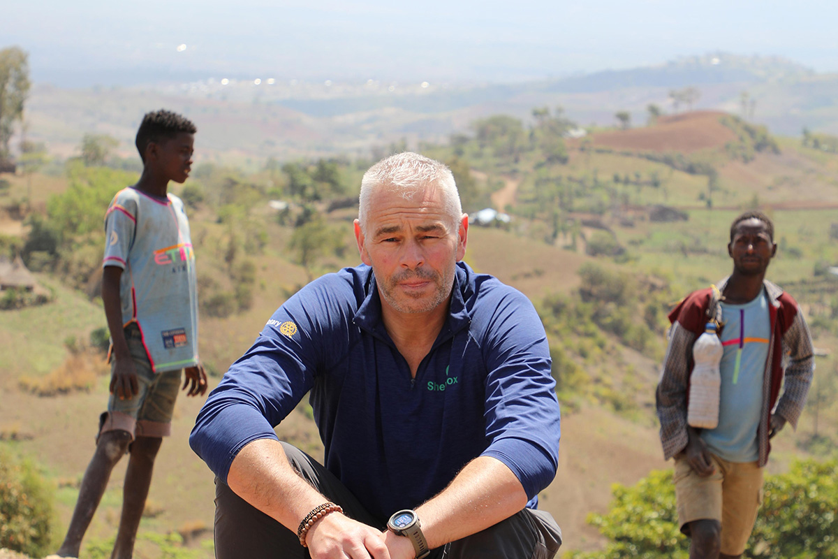 Man sitting in front of mountains in Ethiopia