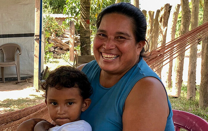 Woman holding a child in Honduras