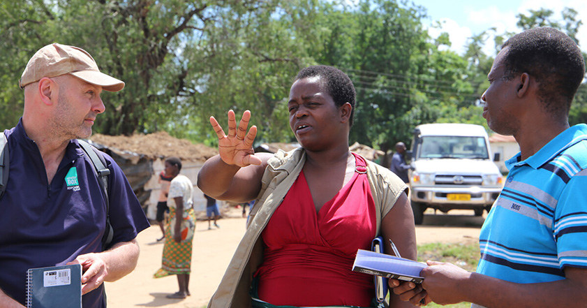 Three humanitarians talking in Malawi