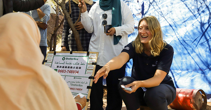 ShelterBox team member talking to community members in Morocco