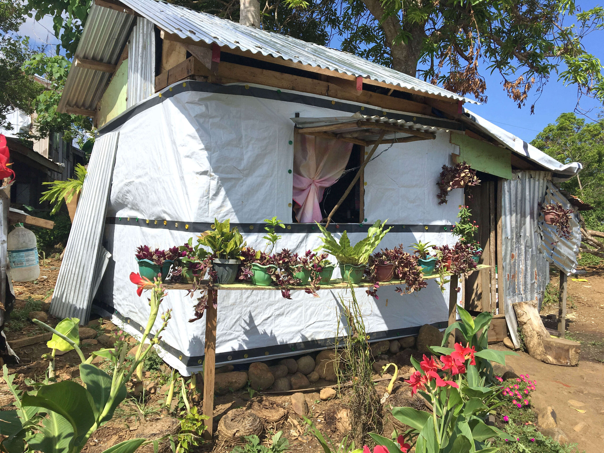 Home constructed with tarpaulins and shelter kit in the Philippines after Typhoon Mangkhut