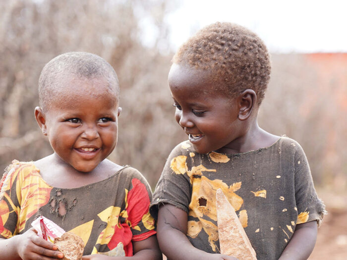 Two young boys smiling in Somalia