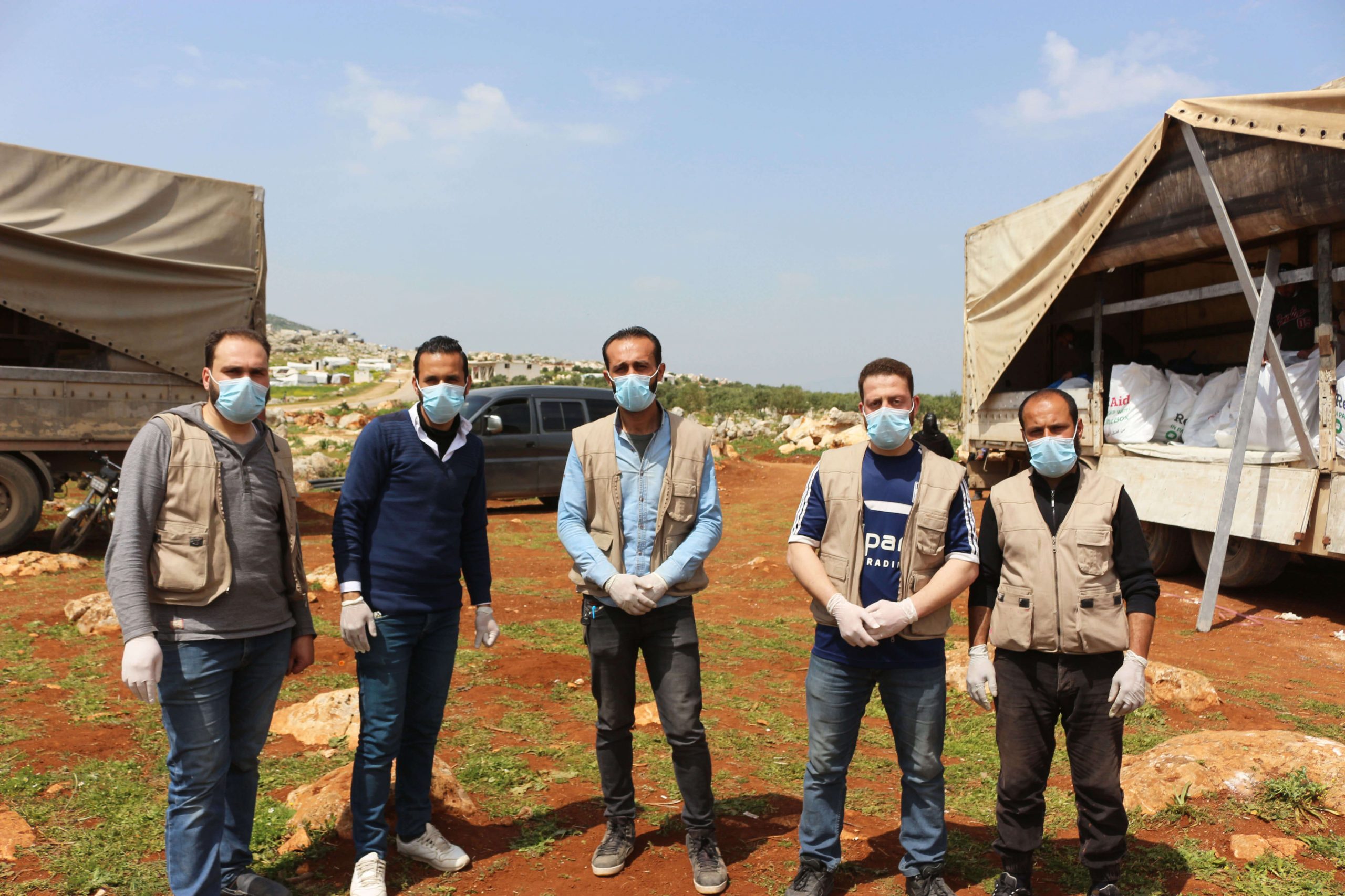 ReliefAid aid workers wearing facemasks in Syria