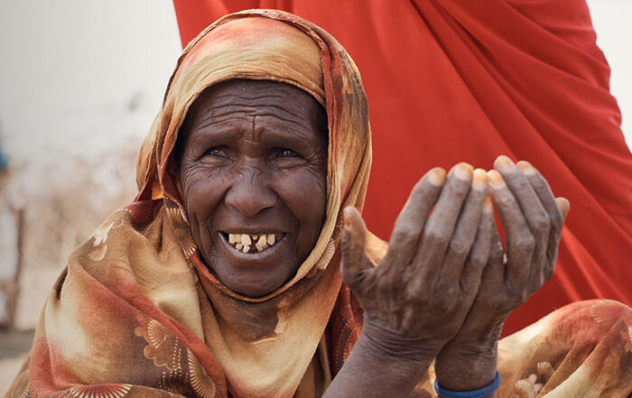 Woman wearing orange head scarf in Somaliland