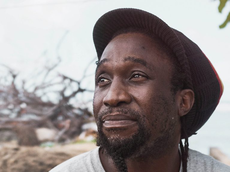 Portrait of man wearing a red hat on Dominica in the Caribbean