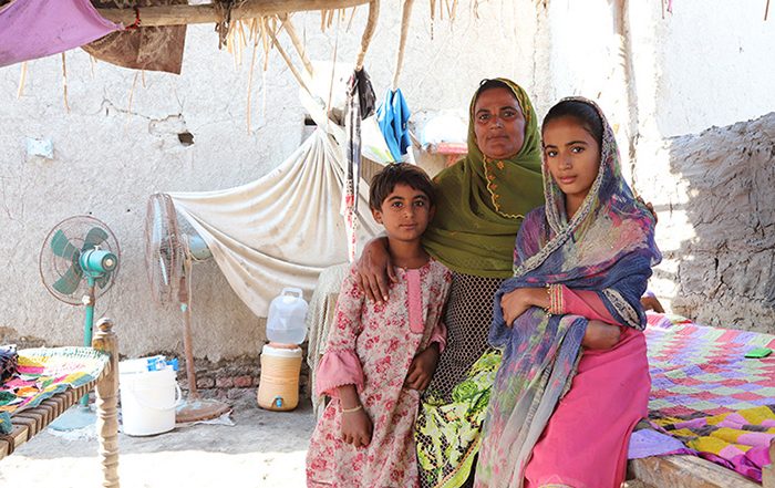 Woman and two girls in a shelter in Pakistan