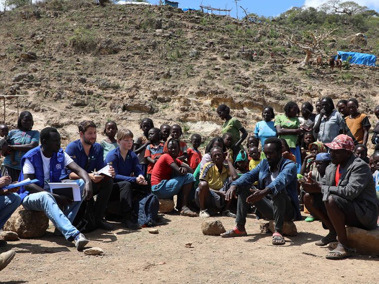 Group of people sitting around talking in Ethiopia