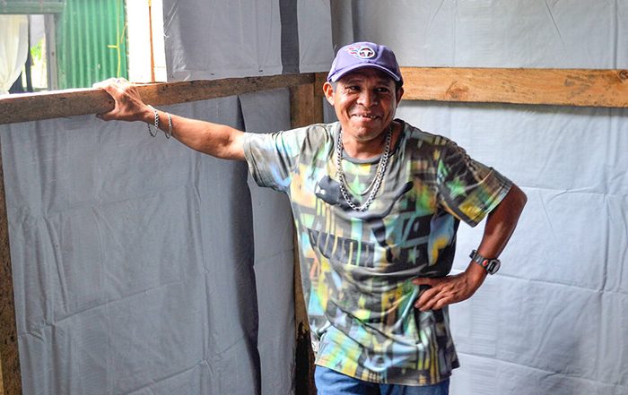 Man standing inside a shelter in Honduras
