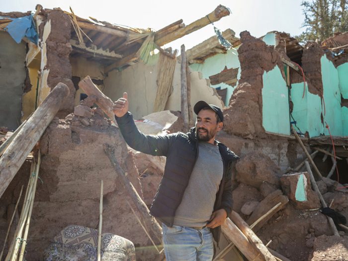 Man in a destroyed home in Morocco