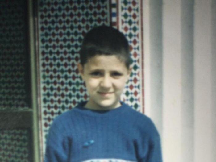 Boy wearing a blue jumper
