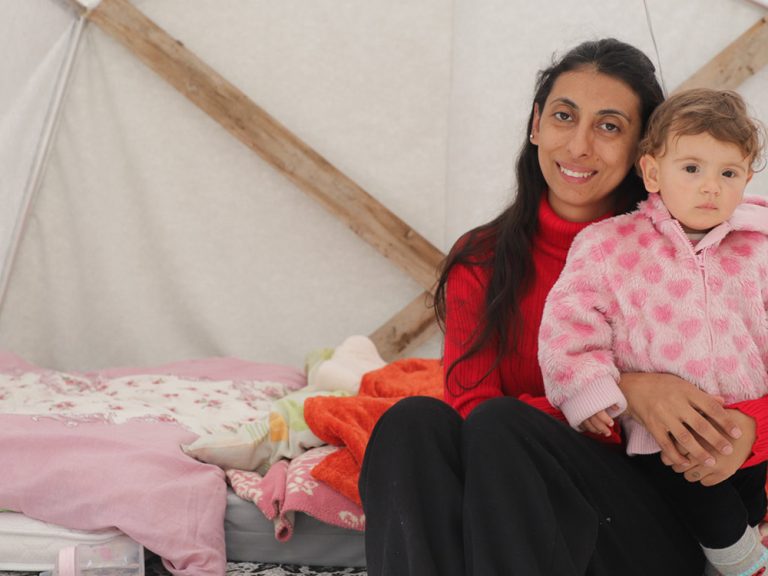 Woman and child inside a tent in Turkey