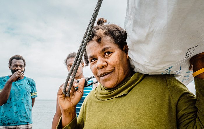 Person holding bag of aid in Vanuatu
