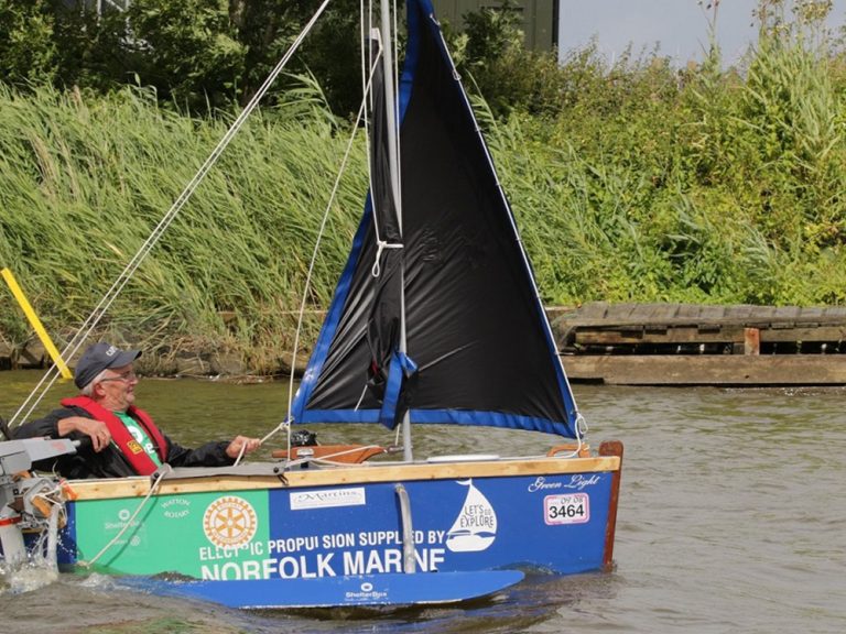 Man in homeade boat on river