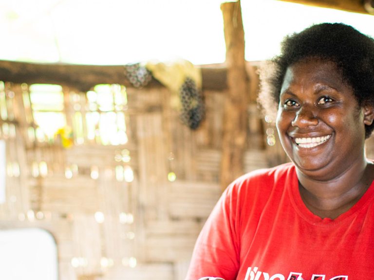 Woman smiling at the camera in a building in Vanuatu