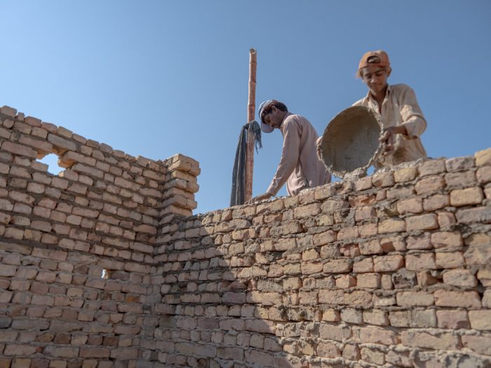Men building a wall in Pakistan