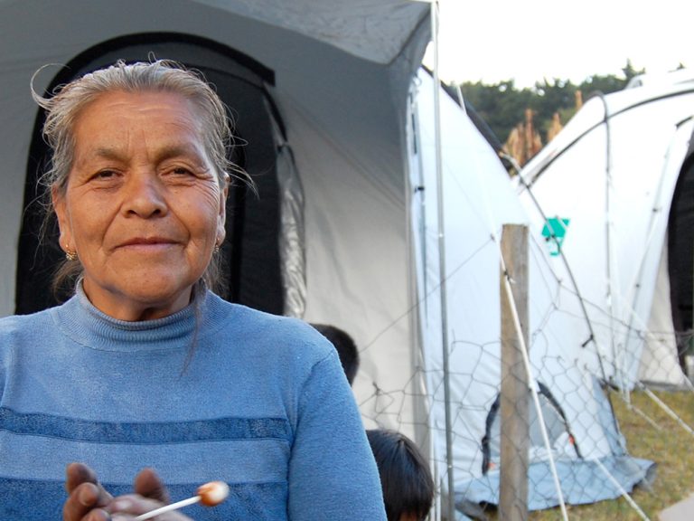 Woman outside tent in Guatemala