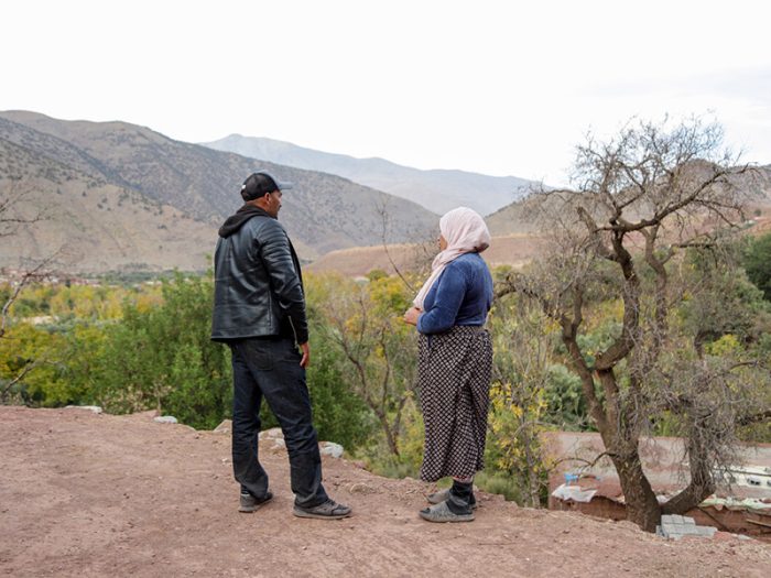 Man and woman speaking in the Atlas mountains in Morocco