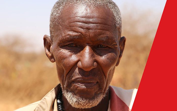 Man in Somaliland with red at side of screen