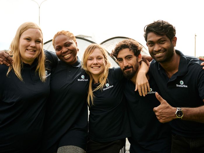 Group of people in black ShelterBox shirts