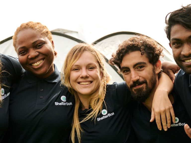 Group of people wearing ShelterBox shirts