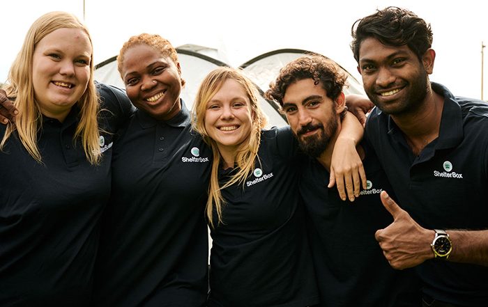 Group of people wearing ShelterBox shirts