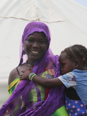 Woman holding child in Chad