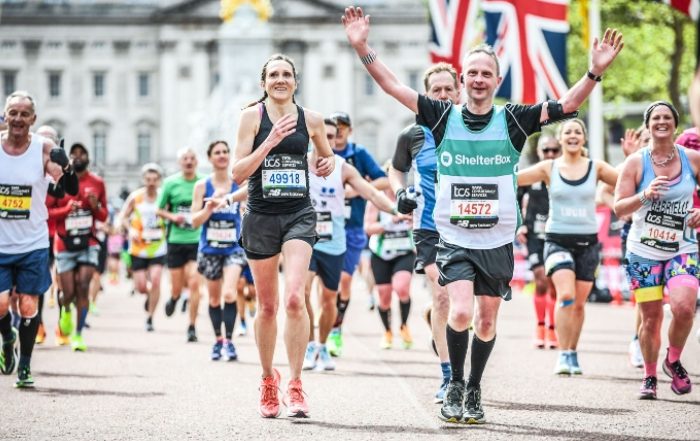 Man wearing ShelterBox vest among runners in London Marathon