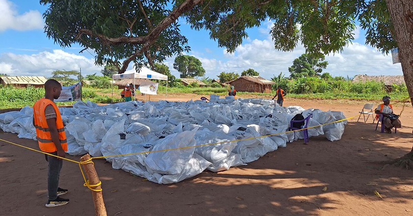 Bundles of aid waste in Mozambique waiting to be collected.