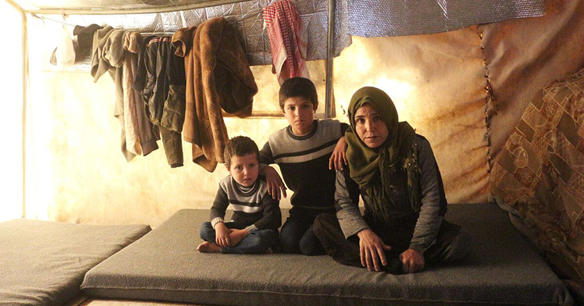 Woman and two children in a shelter in Syria