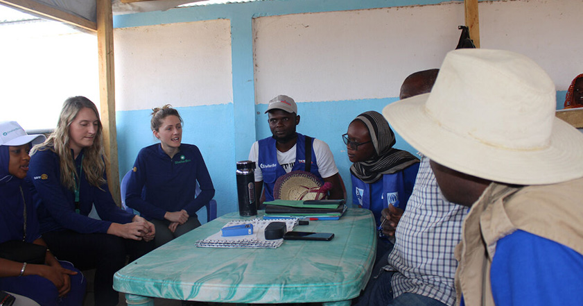 Group of people sitting around a table in Cameroon