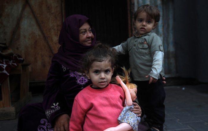 Woman and two young children in Gaza