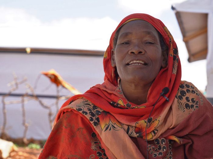 Woman wearing red head scarf in Somalia