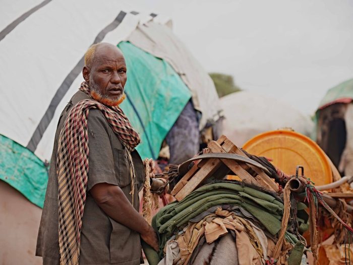 Man next to a donkey and cart